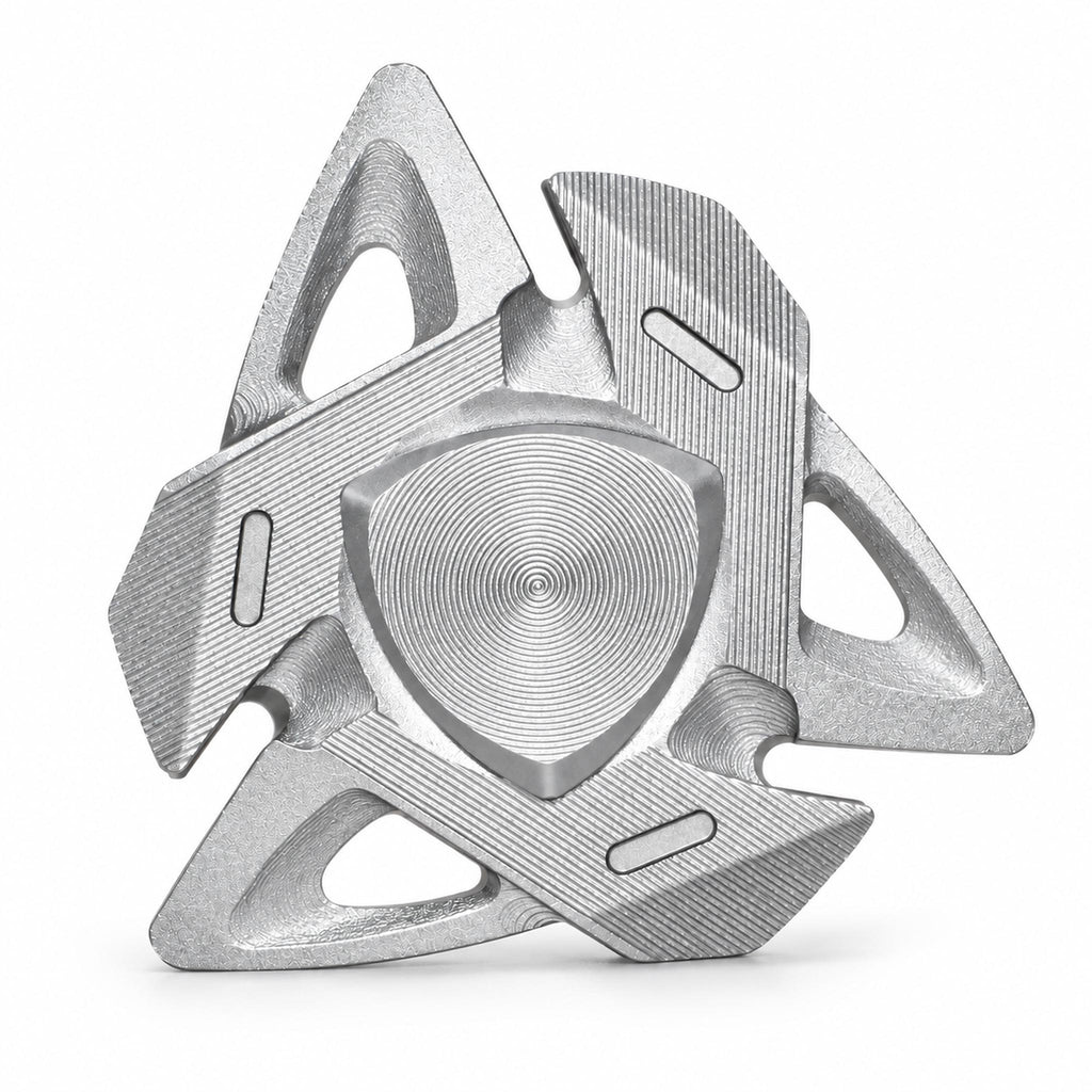 Silver shark fin aluminum alloy fidget spinner on white studio background