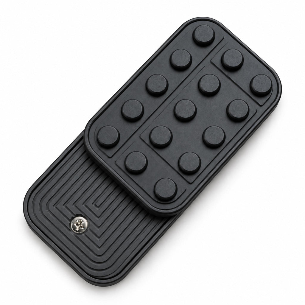 Matte black studded metal fidget slider top view on clean white backdrop