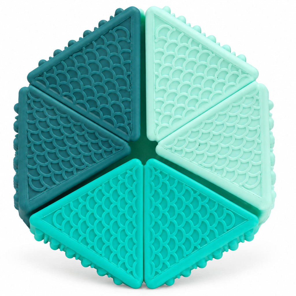 Close up of two-color reversible sensory cube showing textured bumpy panels
