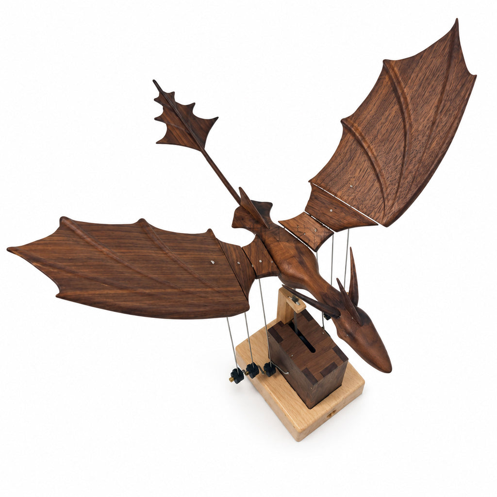 Top overhead view of wooden dragon automaton showing detailed wing bone carvings