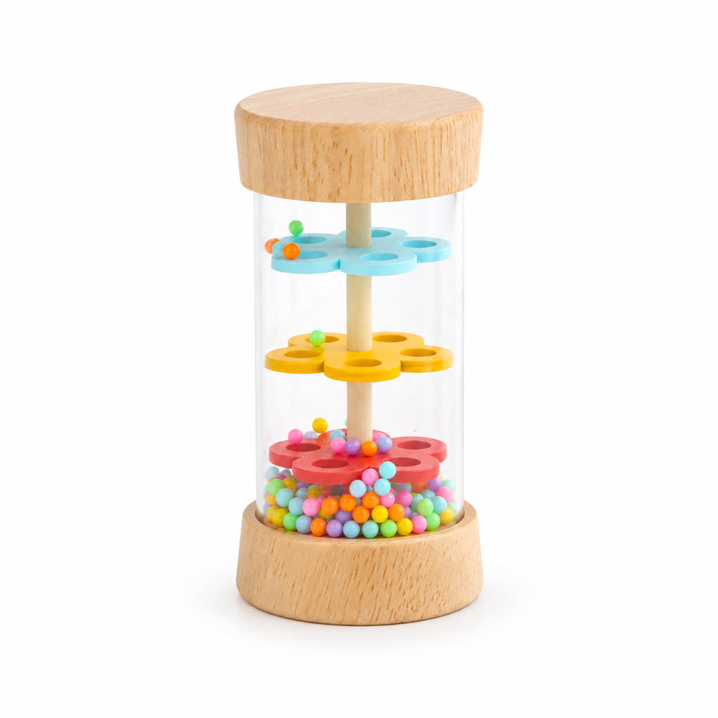 Small wooden rain stick toy with colorful beads and flower-shaped plates, isolated on a white background.