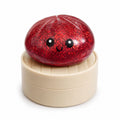 Ruby red sparkling glitter bao bun fidget squishy in display steamer basket