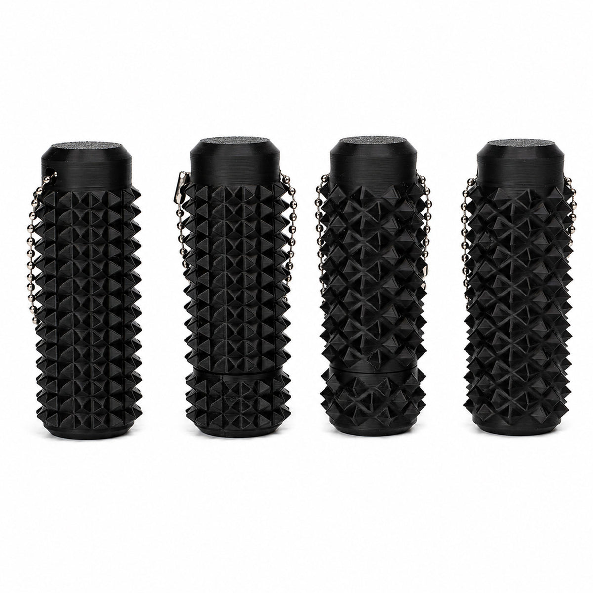 Matte black spiky finger massage roller fidget keychain on white backdrop