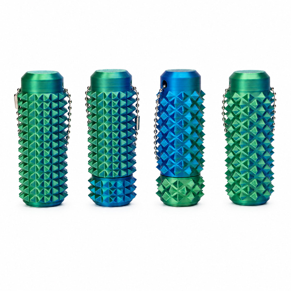 Teal and green dual-color spiky acupressure fidget roller on white